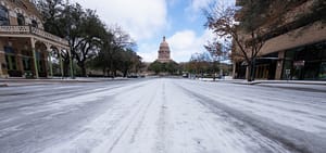 A photograph of an empty, icy road in Texas after an ice storm