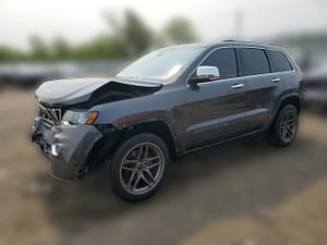 2020 Jeep Grand Cherokee Limited SUV with front-end collision damage at a salvage auction
